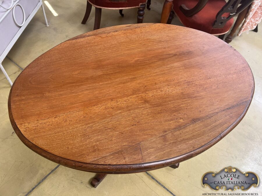 <h2>Antique oval table</h2>
<em>Antique oval table, walnut wood</em> Gheridon style, with central twisted leg. Dated back 19th century.