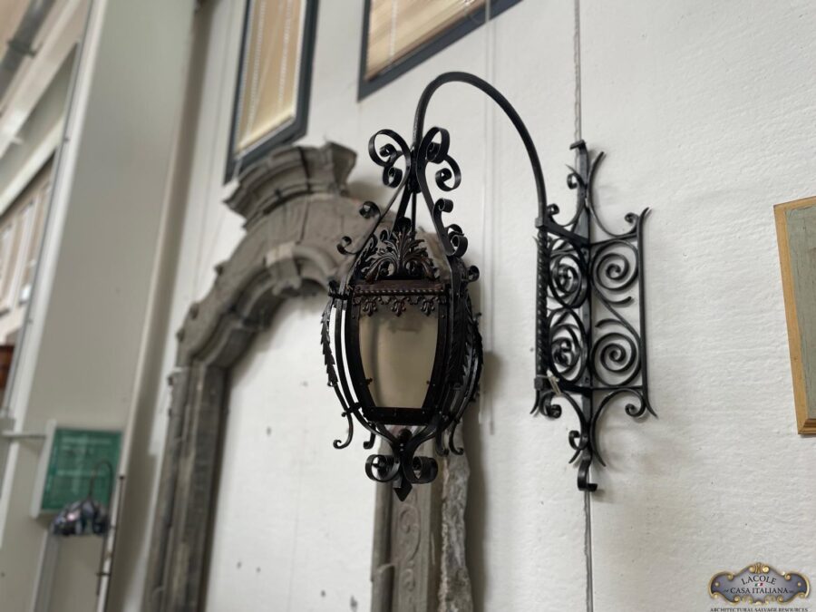 Antique forged iron wall light , it manteince its original glasses , dated back late 18 century , electrified beginning of 19 century .